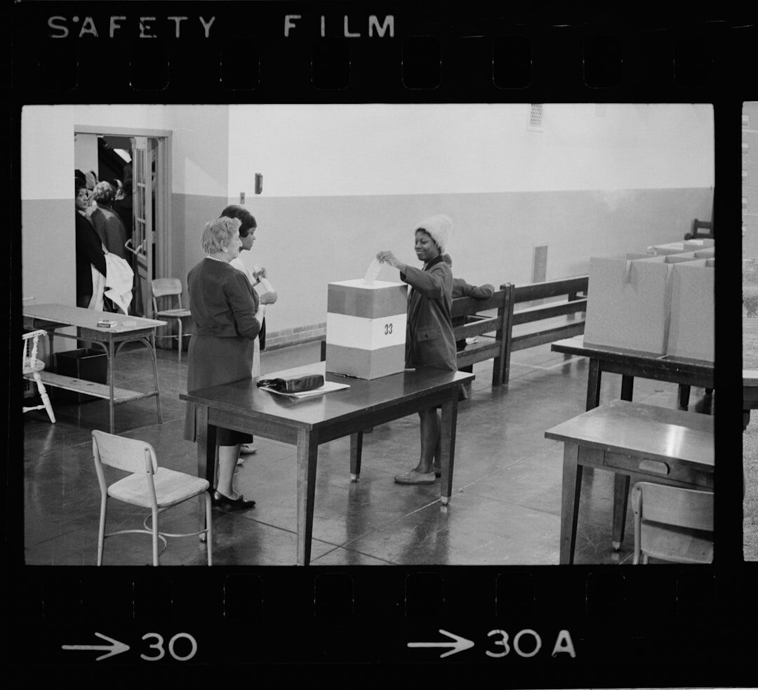 Small editorial team reviewing archive footage together