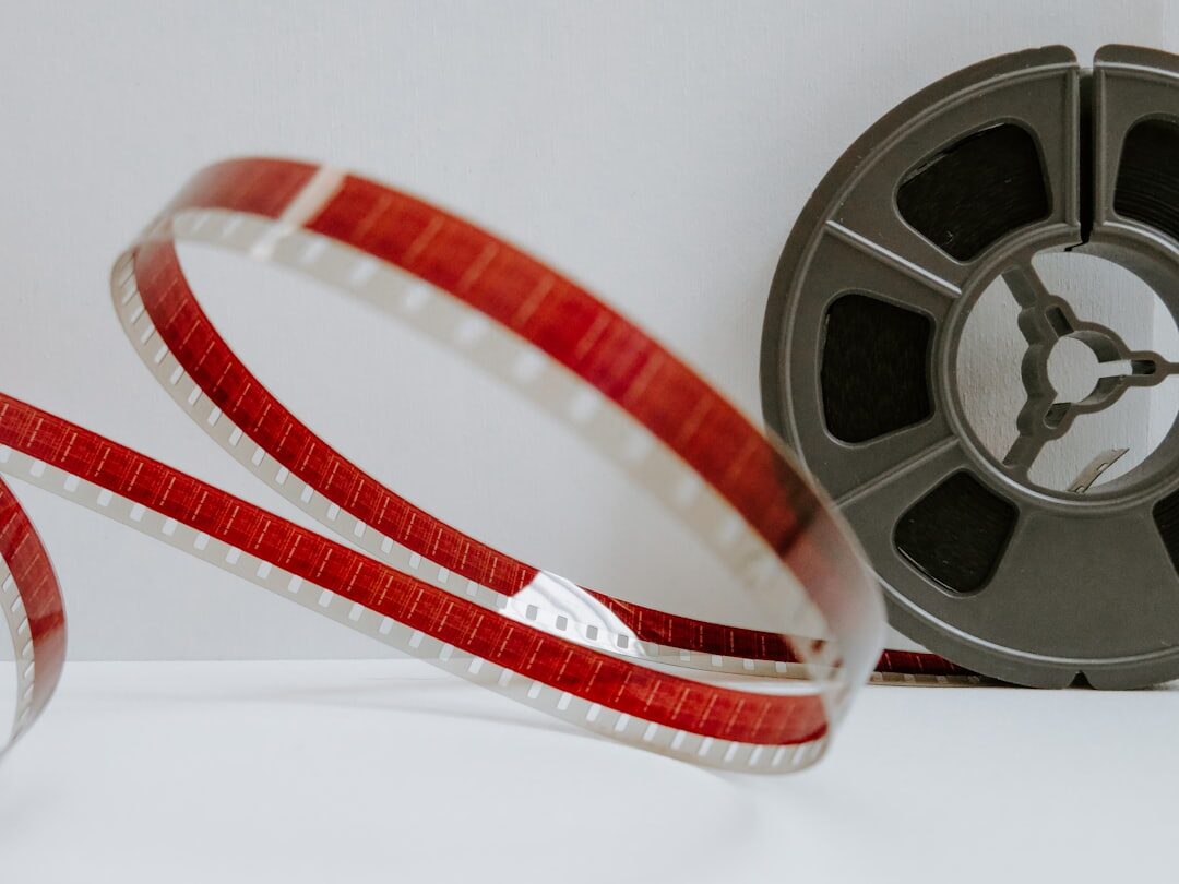 Stack of archival film reels and video tapes