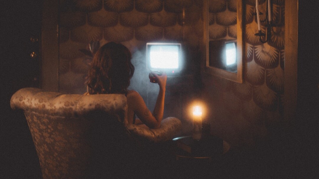 person watching tv alone